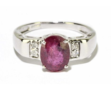 An 18ct white gold ruby and diamond ring, size N, approx. 4.2g.