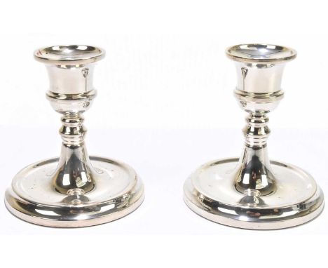 WI BROADWAY; a pair of Elizabeth II hallmarked silver squat candlesticks, Birmingham 2003 (filled), height 11cm.Condition Rep