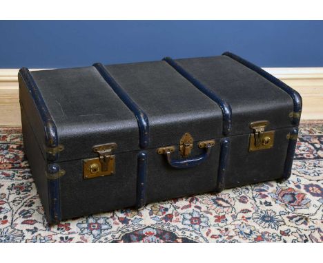 A vintage blue wooden bound travelling trunk. 