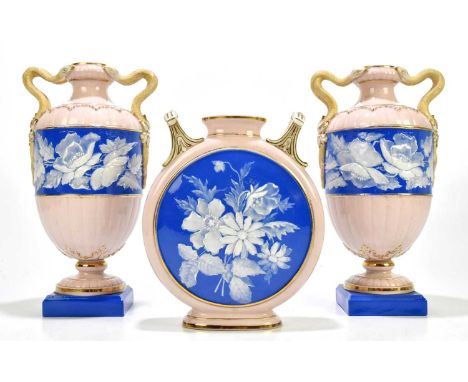 GRAINGERS ROYAL CHINA WORKS WORCESTER; a pair of late 19th century twin handled pedestal pate-sur-pate vases, with serpent ha