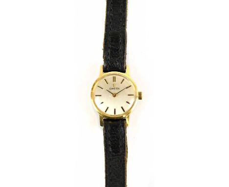 OMEGA; a lady's 9ct gold wristwatch with baton numerals and leather strap.Condition Report: The watch is running though we ca