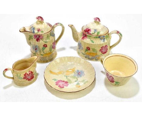 MASONS; a 'Sampler' pattern part tea set, to include a cup and saucer, a cream jug, a tea pot and a coffee pot (5)Condition R