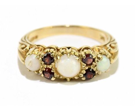 A 9ct yellow gold garnet and opal ring, size M, approx. 3.5g.