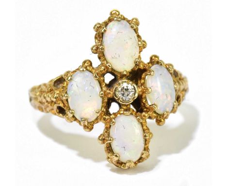 A 9ct yellow gold opal and diamond ring, centred with a small round brilliant cut diamond within a textured cluster setting o