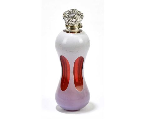 A Victorian white metal mounted ruby and opaque glass scent bottle and stopper, the hinged cap with engraved floral detailing