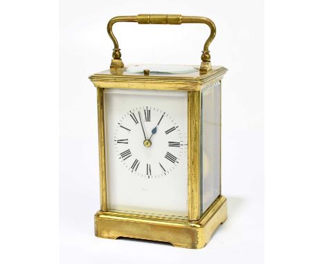 A 19th century French brass cased repeating carriage clock, the enamel dial set with Roman numerals, height 17cm. Condition R