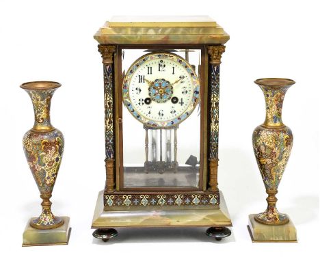 A 19th century French onyx and champleve enamel three piece clock garniture, the four glass clock of rectangular form with st