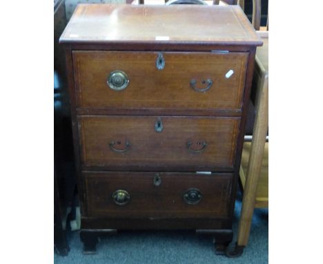 A 19th century mahogany chest of three long drawers, with satinwood banding and stringing on ogee bracket feet. 60cm wide.