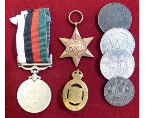 A WWII 1939-45 Star, a Pakistan 23rd March 1956 Independence Medal, a WWI Ordnance Factory on War Service Badge, a 1974 D-Day