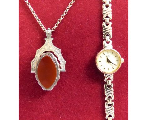 A 9ct gold Rotary ladies wristwatch, 11 grams, together with a gold plated Victorian swivel locket/fob to a gold chain. 