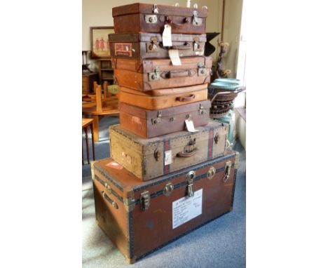 A cabin trunk, together with a selection of leather and other suitcases (7)