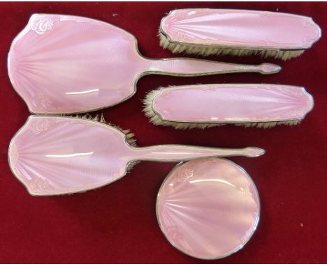 A silver & pink enamel five piece dressing table set, Birmingham 1935, (Coronation duty mark) comprising mirror, hair brush t