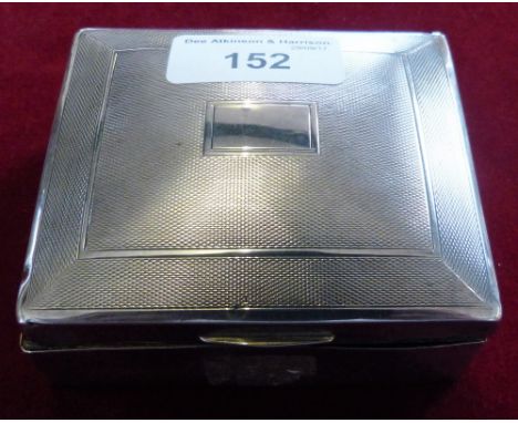 A silver cigarette box, Birmingham 1936, with engine turned cover. 9 x 8 x 4cm