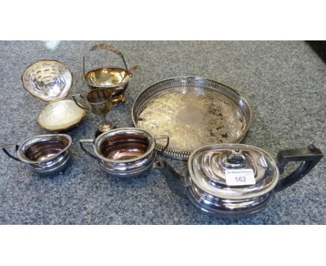 A three piece electroplated tea service and other plated wares.