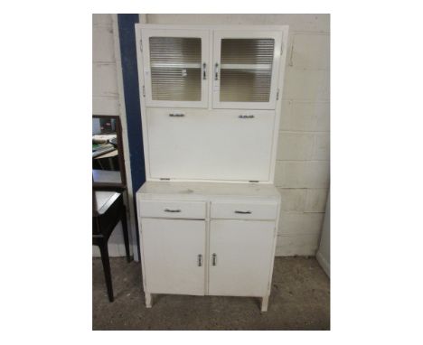 WHITE PAINTED KITCHEN CUPBOARD WITH DROP FRONT WITH ENAMEL TOP FITTED WITH TWO GLAZED DOORS AND TWO DRAWERS OVER TWO PANELLED