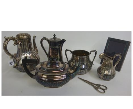 A Victorian electroplate three piece coffee service, with lobed and fluted sides, an electroplate teapot, a hot water pot, a 