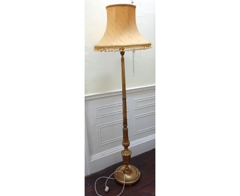 A turned, carved and fluted column giltwood standard lamp, 20th century, with shade and a pair of carved giltwood six light c