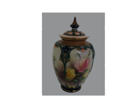 A Hadley's Worcester porcelain baluster vase and cover, painted with roses within raised strapwork panels, 15cm high