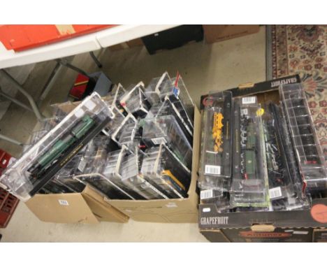 Collection of 40 plastic model locomotives on stands, all within the original packaging from magazines 