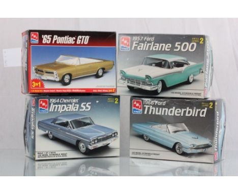 Four boxed and unbuilt AMT ERTL plastic model kits to include 1966 Ford Thunderbird, '65 Pontiac GTO, Fairlane 500 & 1964 Che