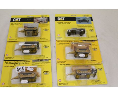 Six carded and unopened Norscot CAT diecast model farming vehicles