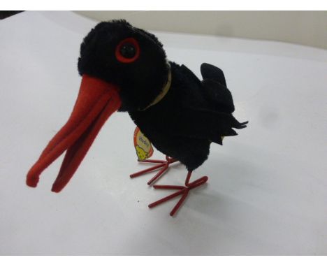 Steiff Hucky raven soft toy with button, yellow tag and name tag