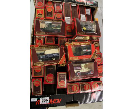Collection of boxed Matchbox Models of Yesteryear diecast model vehicles in red boxes (approximately 50)