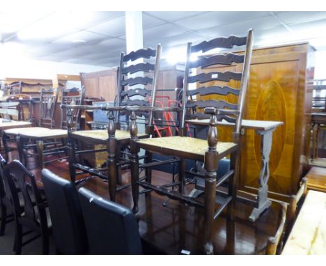 A PAIR OF REPRODUCTION OAK DINING CHAIRS,  HAVING LADDER BACKS WITH RUSH SEATS AND A PAIR OF HARDWOOD LADDER BACK SINGLE CHAI