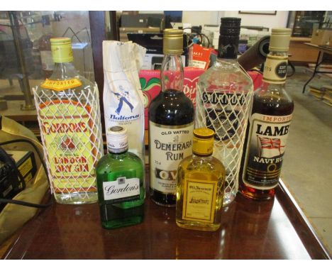 Gordons Gin, Smirnoff Vodka, 2 Bottles of Rum and 3 Others