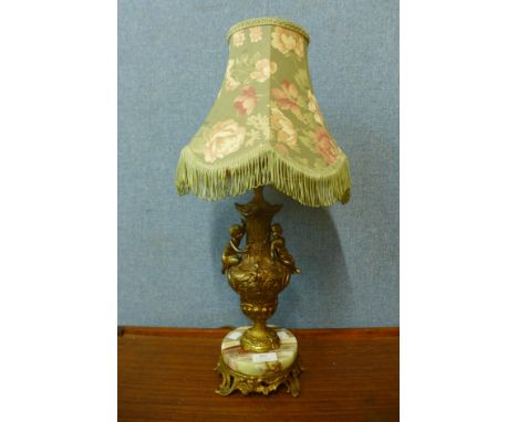 A French style brass and onyx table lamp 