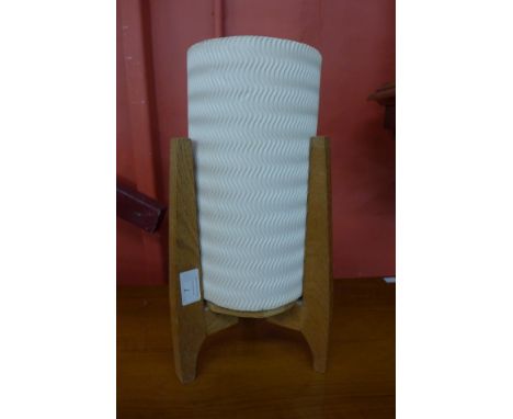 A small teak rocket lamp 