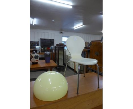 An Arne Jacobsen style cream bent plywood and chrome child's chair and a lamp shade 