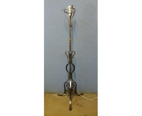 A wrought steel and brass standard lamp 