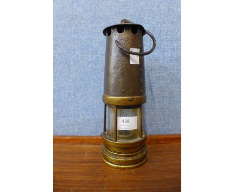 A brass miner's lamp 