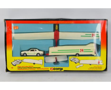 Corgi - A boxed set 12 Honda Prelude and Glider with trailer. The models appear in Good overall condition with light signs of