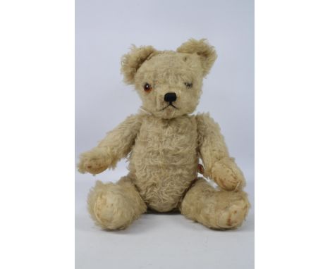 Alpha Farnell - A vintage Alpha Farnell teddy bear circa 1930s. The fully jointed, vintage blonde mohair bear, features a bla