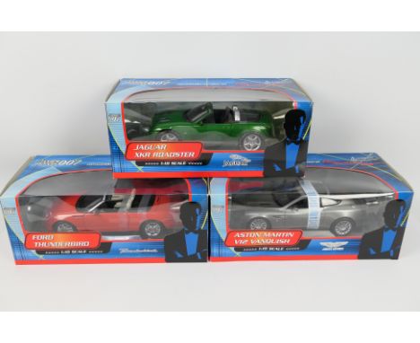 Paul's Model Art - James Bond - 3 x boxed James Bond cars in 1:18 scale, Aston Martin V12 Vanquish # 10011, Jaguar XKR Roadst