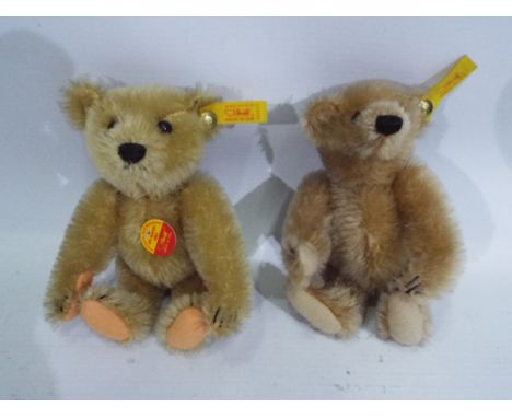 Steiff - Two Steiff bears, Golden bear 029592 & beige bear 029073 approx 16 cm (h). Each with gold Steiff button and yellow l