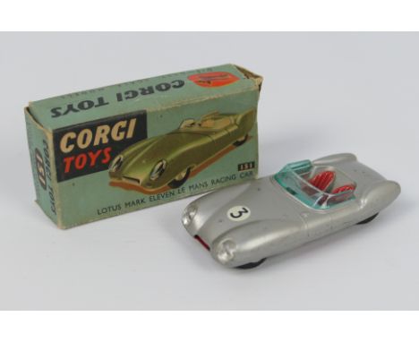 Corgi - A boxed Lotus Mark Eleven Le Mans Racing Car # 151. This version in silver shows light signs of use and appears in Ve