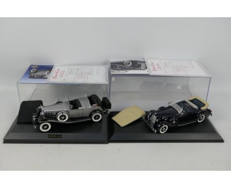 Danbury Mint - 2 x models in 1:24 scale, a 1932 Cadillac V-16 Sport Phaeton in Silver and a 1936 Packard Twelve Sport Phaeton