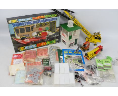 A large selection of loose and boxed model railway and diecast items including decals, electrical fittings, spare wheels and 