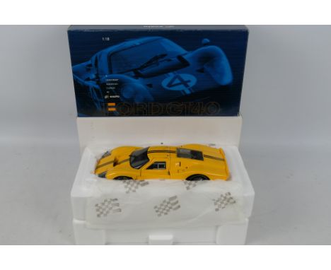 Exoto - Racing Legends - A boxed 1:18 scale Ford GT40 MkIV in yellow celebrating 100 years of Ford Racing # 18050. The model 