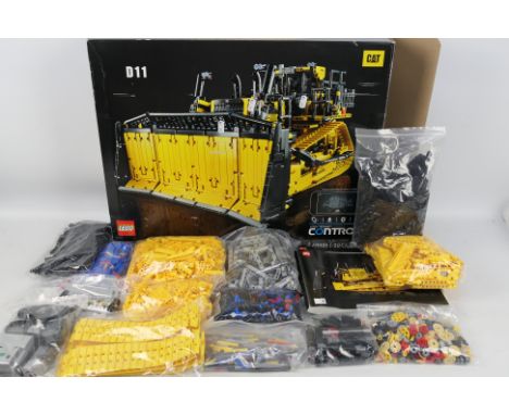 Lego  - Lego Technic CAT D11T bulldozer # 42131. Box is open with manual 1 and 2 and internal white box. THE pieces have been