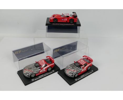 Fly - 3 x boxed slot cars, a Marcos 600 LM number 33 car from the 2000 Autosport International Show # E26B and 2 x special ed