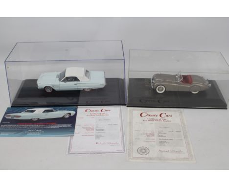 Danbury Mint - 2 x 1:24 scale models, a 1949 Jaguar XK120 Roadster in Silver Grey and a 1965 Ford Thunderbird in Diamond Blue