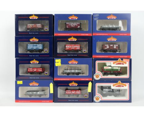 Bachmann - A rake of 12 Bachmann Branchline OO gauge freight wagons. Lot includes#37-933 3 plank wagon LMS grey; #33-179A 10 
