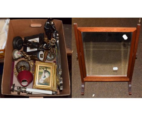 Two pairs of decorative figural candlestick, an Art Nouveau easel style mirror, a mahogany toilet mirror with other items 