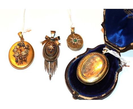 Four Victorian lockets including an oval locket with a star motif formed of an emerald and split pearls; a floral engraved ov