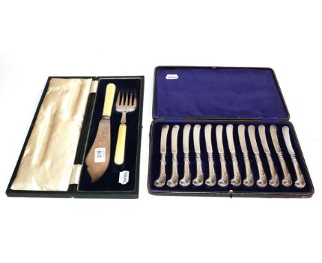 A cased set of twelve silver handled tea knives and a cased silver and ivorine fish service 