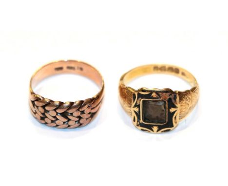 An 18 carat gold mourning ring, finger size R; and a rope work ring, stamped '9CT', finger size R (a.f.).  Gross weight 9.4 g